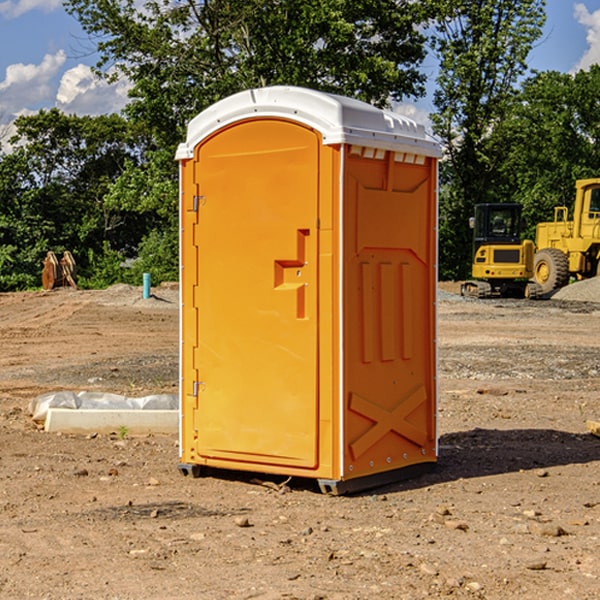 how often are the portable restrooms cleaned and serviced during a rental period in Manchaug